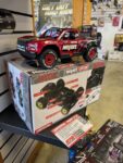 ARRMA MOJAVE GROM MEGA 380 Brushed 4X4 Small Scale Desert Truck RTR with Battery & Charger, Red/Black